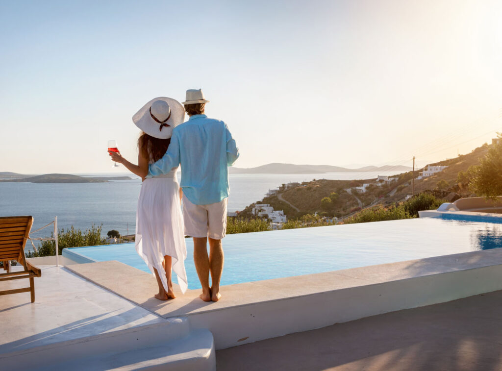 Couple by the pool at a perfect blue villa