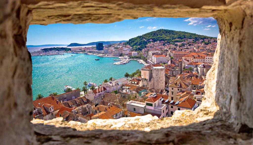 Split bay aerial view through stone window