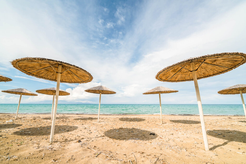 Sunshades,On,The,Tsilivi,Beach,In,Summer,On,Zante,Island,